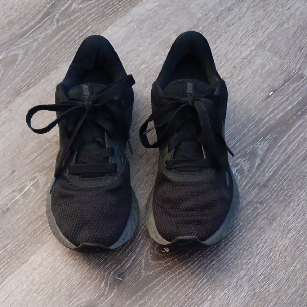 Nike Revolution Preloved Black Mesh Sneakers in Good Condition.
